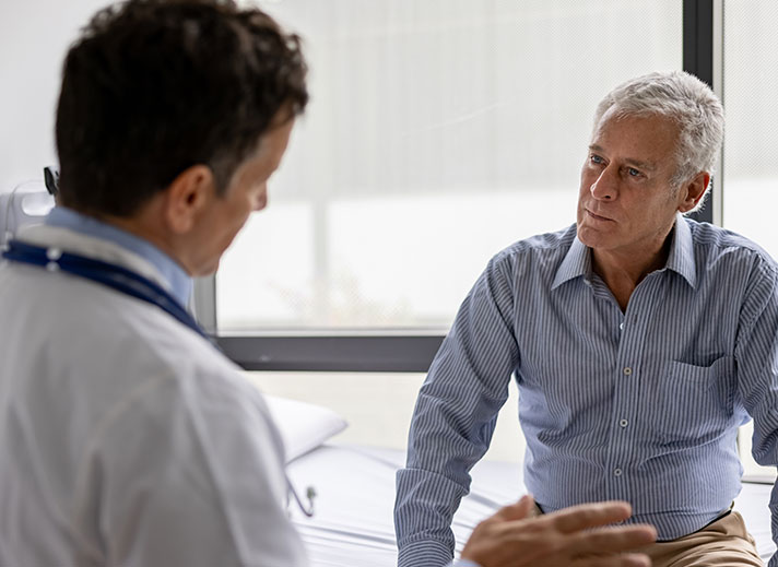Doctor with adult patient.
